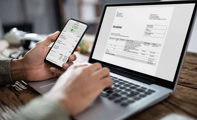 a person verifying invoices on a computer