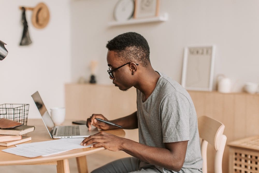 a person sitting at a desk looking at their chart of accounts